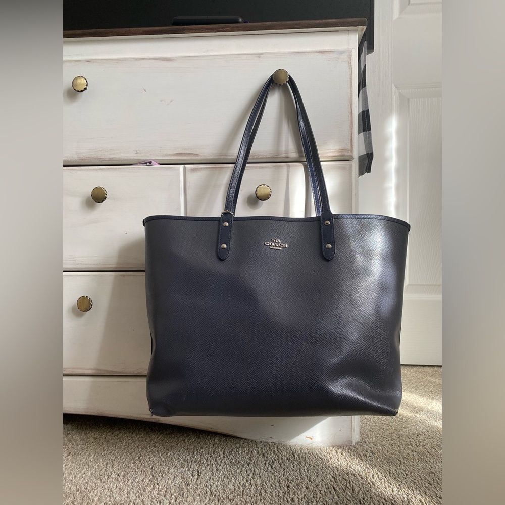 Large black Coach tote with matching (larger) wristlet.